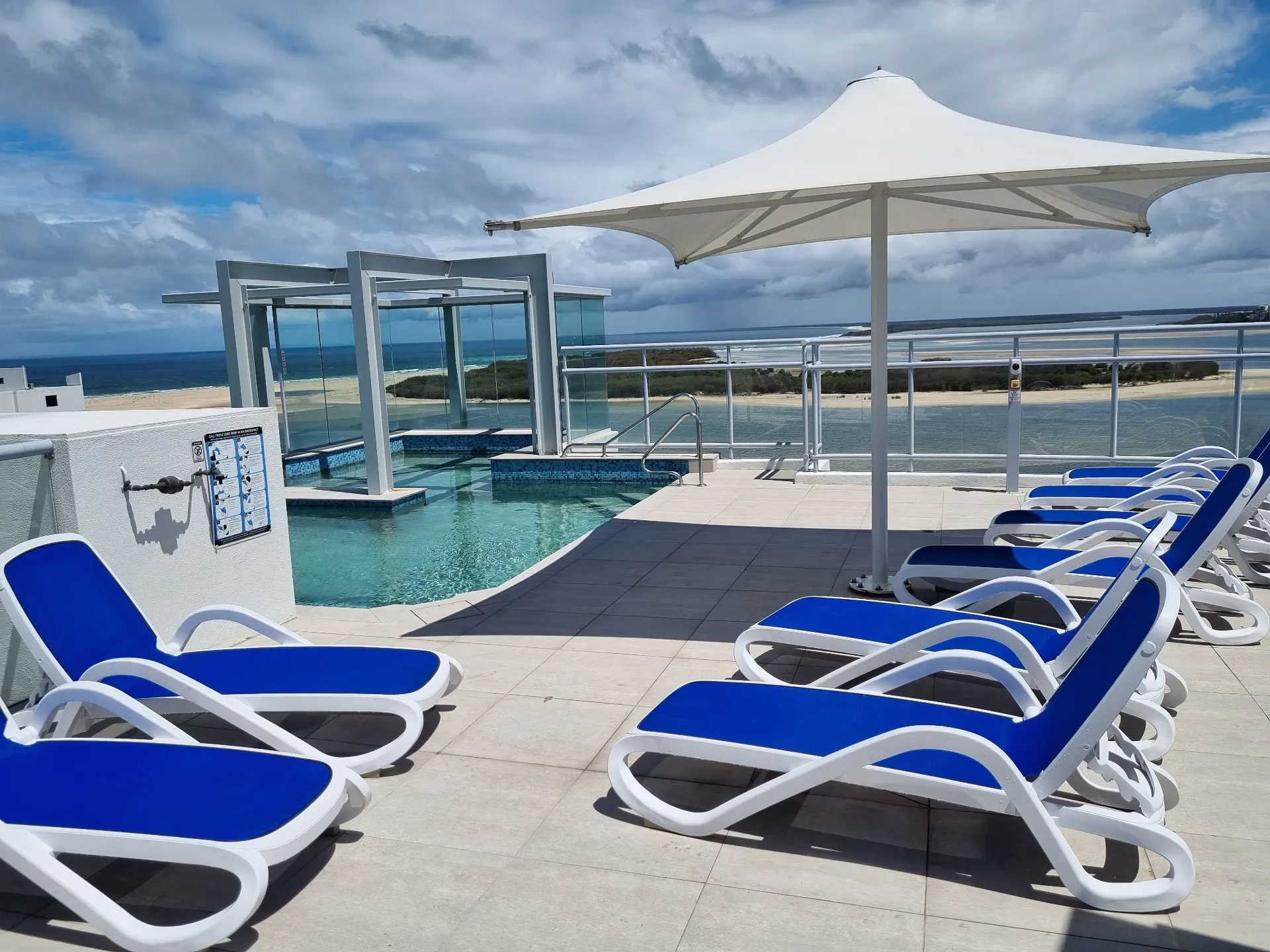 Shared Level 12 rooftop heated pool with ocean views